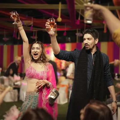 Toasts to a new beginning! The Sangeet night is for celebrating, and I'm there to capture the high spirits and unfiltered fun.