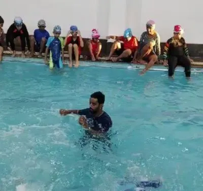 The last day of summer camp often ends with a big splash and lots of fun with the coach.