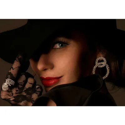 A vibrant and mysterious look created for a jewelry shoot. The dramatic lighting, bold colors, and styling come together to create a high-fashion image that is both alluring and sophisticated.