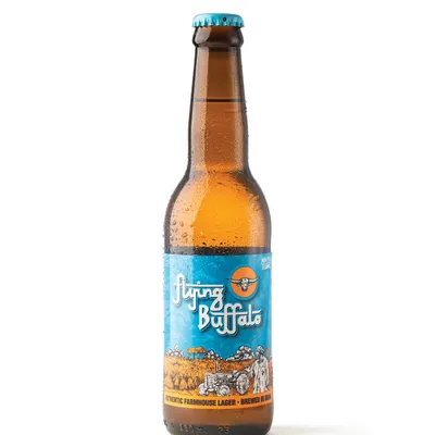 This is a perfect example of a clean, high-quality e-commerce shot for Flying Buffalo beer. The crisp white background, perfect condensation, and clear lighting make the product look professional and refreshing.