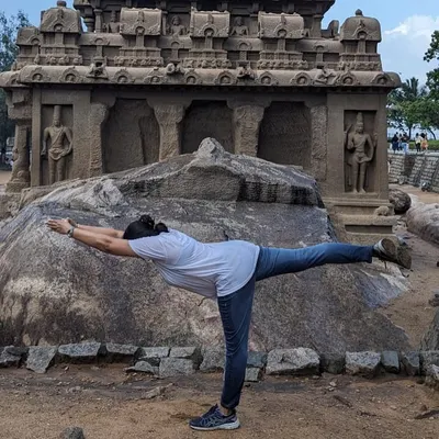 We are so proud to see our students take their practice with them on their adventures. Here, our dedicated student Suma holds a strong Virabhadrasana III (Warrior III pose) in front of an ancient stone monument, beautifully blending history and wellness.