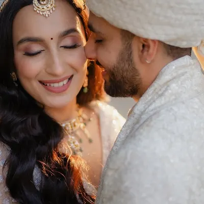 A close-up of a tender moment between the bride and groom, filled with genuine emotion and happiness. These are the candid shots that truly tell a love story.