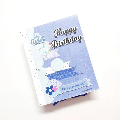A pretty A5 size "Happy Birthday" scrapbook in a lovely blue theme, designed as a special gift for a client's husband.