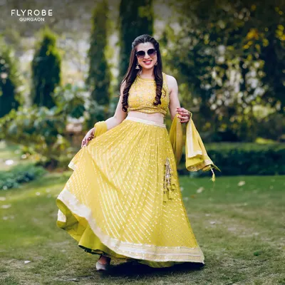 This happy client is glowing in a bright yellow lehenga, rented for her Haldi ceremony. It’s the perfect outfit to shine bright during your festivities.