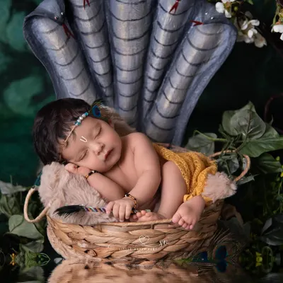 This powerful portrait of our little Kanha resting under the protection of Sheshnag is one of my favorites. I work with talented artisans to create custom props that bring these divine stories to life with authenticity and beauty.