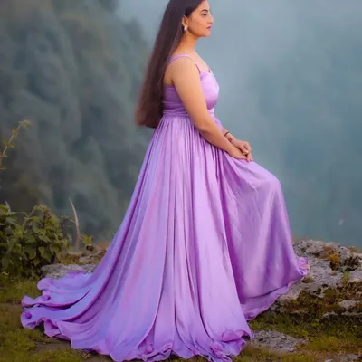 A side profile of the custom lavender gathered dress, showing how the fabric drapes beautifully. I designed this piece to be both elegant and comfortable, allowing for natural movement during a photoshoot. It's available for custom order in any color.