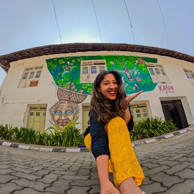 The finished mural in Fort Kochi, 'The Silver Eyes of Kochi'. It was an honor to paint this tribute to the local fisherwoman, whose spirit and hard work are the backbone of the community. Now, her story is woven into the fabric of this beautiful street.