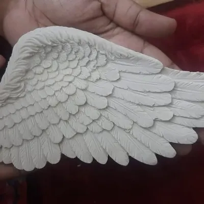 This is the final cast from my 7-inch angel wing mold, held in hand to show its size and intricate feather detail. The texture is clean and precise, ready to be painted or added to your artwork.