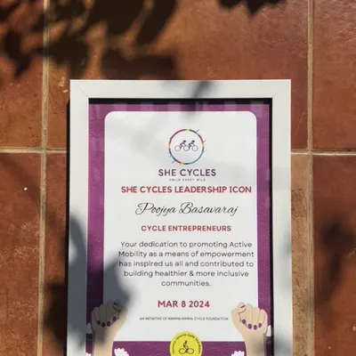 A close up of the "She Cycles Leadership Icon" award. This recognition from the Namma Nimma Cycle Foundation honors our dedication to building healthier and more inclusive communities through cycling.