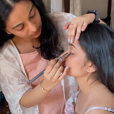 Here I am, focused on the details of an eye makeup application. Precision is key, especially for close-up beauty shots.