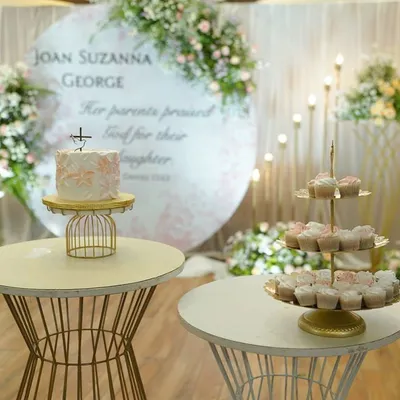 A beautiful baptism cake and matching cupcakes on a treat table. I love this trend of setting up a dessert table for events. It's such a hit with both kids and adults!