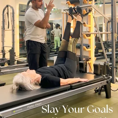 Your goals, our mission. With one-on-one training, we tailor every session to you, like helping this client perfect her leg presses on the Cadillac.