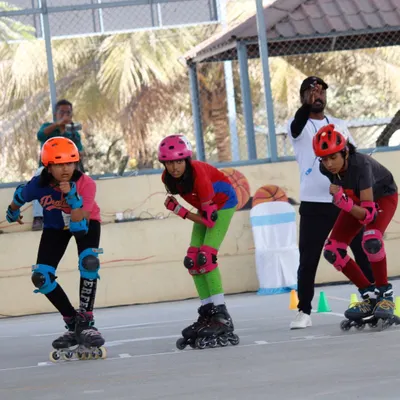 Our speed skating team at the starting line, getting final instructions from the coach. This is where practice meets performance. We train them for the focus and explosive power needed for a successful race start.