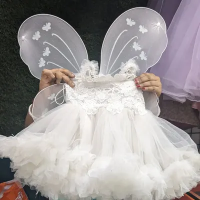 Make your little one feel like a fairy princess with this white baby frock, which comes with detachable butterfly wings. The top part is made of soft cotton for all-day comfort.