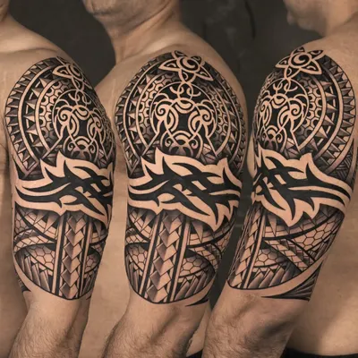 A powerful Polynesian-style half-sleeve. This piece is a perfect example of our expertise in tribal tattoos, featuring bold lines, intricate geometric patterns, and a design that flows with the body's natural form.