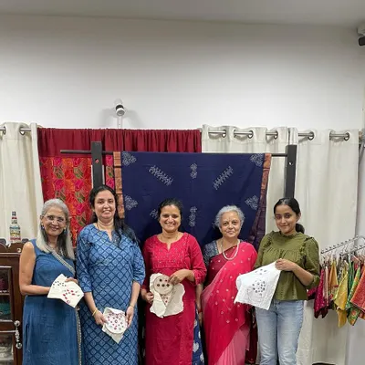 A group of happy students proudly displaying their finished mirror work samplers. It was a wonderful experience teaching these enthusiasts who were so intrigued by the techniques.