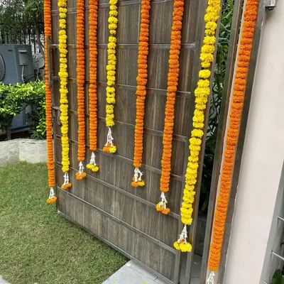 Here is another look at the main gate decorated with vertical garlands of fresh marigold flowers. This is a popular decoration for housewarmings, festivals, and weddings.