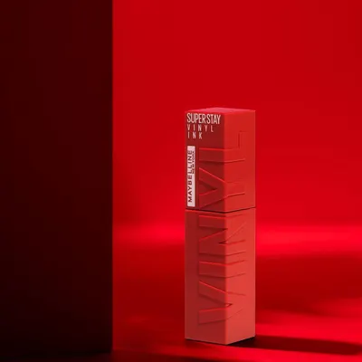A bold and dramatic shot for Maybelline's Super Stay Vinyl Ink. The monochromatic red setup creates a powerful, brand-aligned visual that is both artistic and commercial.