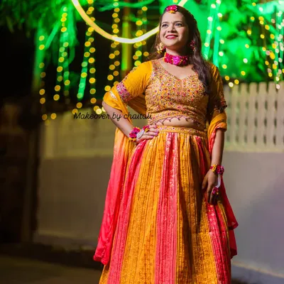 A complete Haldi look for a beautiful bride-to-be. The makeup is bright and glowing to match the festive atmosphere, paired with a simple hairstyle to accommodate floral jewelry.