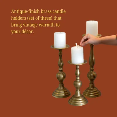 This set of three antique-finish brass candle holders brings a sense of vintage warmth and timeless elegance to any decor.