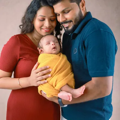 Wrapped in love, held forever in their parents' arms. This is the essence of a newborn family session, capturing the complete adoration and wonder of welcoming a new life.