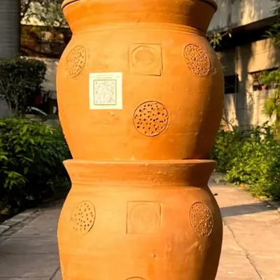 A close-up view of our stackable terracotta composter, showcasing the detailed craftsmanship and porous texture. Its compact and beautiful design makes it a perfect, functional addition to any home, balcony, or garden space.