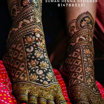 Intricate bridal feet mehndi featuring a beautiful pattern of lotus flowers. The design provides full coverage over the feet, creating a stunning look from every angle.
