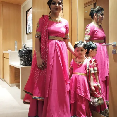 It brings me so much joy to see a happy client and her daughter looking radiant in their matching pink lehenga gowns. I designed these custom outfits with a layered style for the little one and a matching dupatta and gold belt for the mom, creating a perfectly coordinated look for their special event.