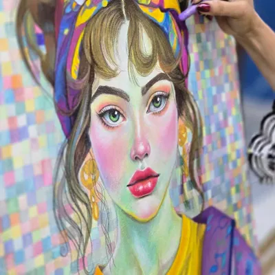 A stunningly vibrant portrait created with oil pastels, showcasing the rich color and blending techniques taught in our program.