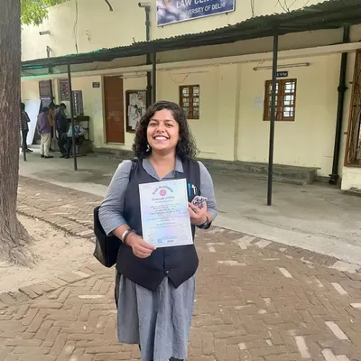 A proud moment holding a certificate outside the Law Centre at Delhi University. My legal education provided the foundation for my career and my passion for advocacy.