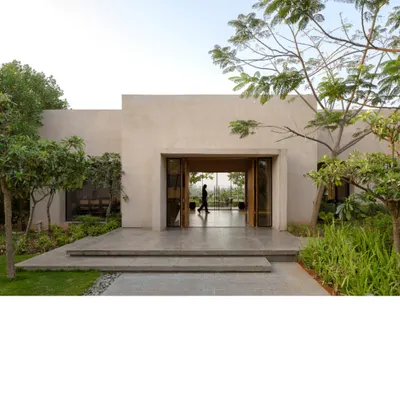 The entrance to the Earthsong experience center is designed to feel like a natural extension of the landscape. The clean, monolithic form with its simple openings invites visitors to slow down and connect with the serene environment.