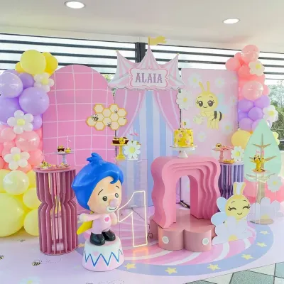 Buzz buzz! A wonderfully sweet bee-themed first birthday for Alaia. This setup features a pastel color palette, honeycomb details, and cute character cutouts.