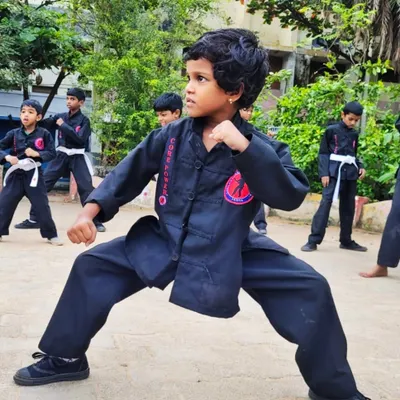 The focus and strong stance of this young girl are amazing. It is moments like these that show me some children are born with martial arts skills.