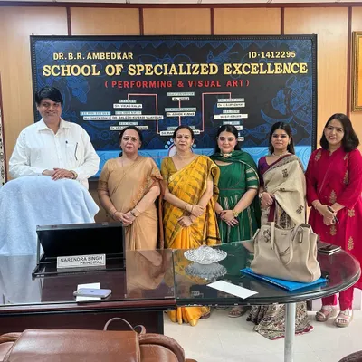 A formal photograph with the principal and esteemed faculty at the Dr. B.R. Ambedkar School of Specialized Excellence. It was an honor to be part of their district-level dance competition.