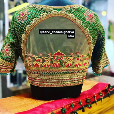 A masterpiece of craftsmanship. This bridal blouse features a 'baraat' procession embroidered on a sheer back panel, telling a beautiful story.