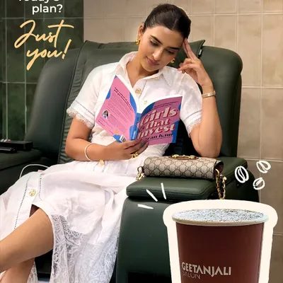 Your appointment is your time to recharge. Here, a client enjoys a relaxing pedicure while catching up on some reading. It's the perfect solo escape to unplug and focus on yourself.