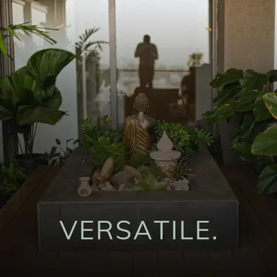This bespoke installation on a high-rise terrace embodies my philosophy of creating tranquil sanctuaries. I designed this custom planter with a serene Buddha statue as the centerpiece, surrounded by hardy succulents and foliage that thrive in an urban environment, crafting a perfect space for quiet reflection.