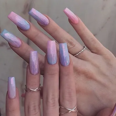 A trendy, long square set with a mesmerizing pastel pink and blue ombre. The entire set is finished with a reflective chrome powder that shifts in the light.