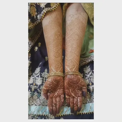 This is the final stain of a full-arm design after 48 hours. The color is a deep reddish-brown on the arms and even darker on the hands, showing the quality of the paste.
