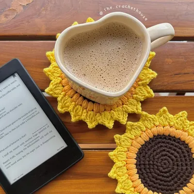 Start your morning with a smile with our handmade crochet sunflower coasters. They are the perfect size for your coffee mug and add a cheerful, pinterest-inspired touch to your desk or table.