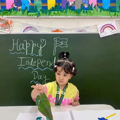 A young artist uses a leaf to print the colors of the Indian flag. This sensory art activity for Independence Day combines patriotism with a hands-on exploration of nature and textures.