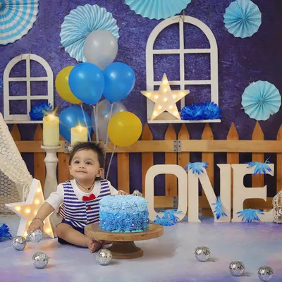 A full view of the charming blue and yellow setup, perfect for a baby boy's first birthday photoshoot.