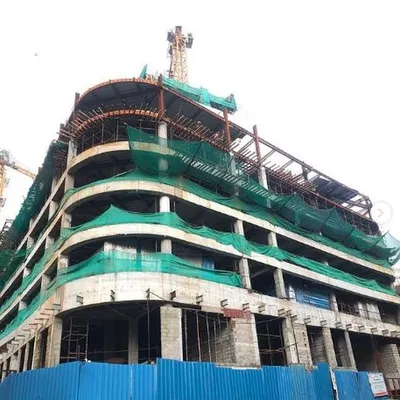 The concrete superstructure of the Earth Enclave residential high-rise takes shape. This image shows the formation of the curved floor plates and podium levels, capturing the raw form of the building before the facade and finishing work begins.