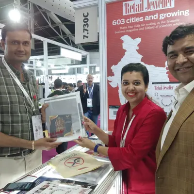 Here I am interacting with a potential client at the Retail Jewellers India booth during a major exhibition. My goal is to be a proactive brand ambassador, sparking conversations and generating leads.