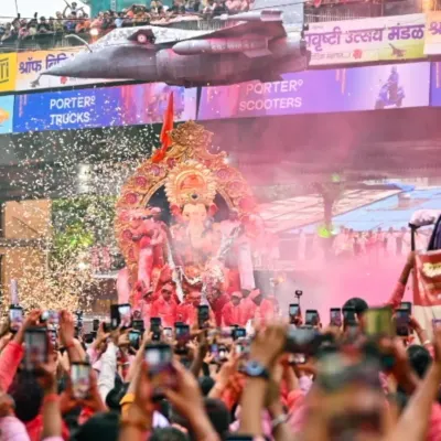 Capturing the grandeur of the Lalbaugcha Raja procession. This shot shows the massive crowd and the incredible energy of the Ganesh Chaturthi festival in Mumbai.