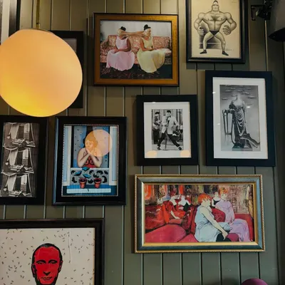 A look at my gallery wall. Each piece has a story, just like the people who visit.