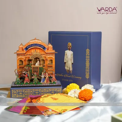 This luxurious pop-up box for an Upanayanam ceremony features a detailed 3D diorama of the sacred ritual. The design, complete with a custom portrait on the box, serves as both a grand invitation and a lasting memento of this significant rite of passage.