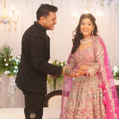 A beautiful, happy moment between the couple at their engagement. Her makeup is a perfect example of soft glam, with glowing skin and bright eyes that light up her face.