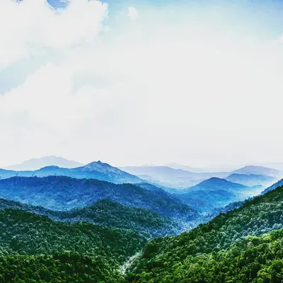 This is a view from near Dharmasthala, showing layers of green hills fading into the distance. I edited this landscape photo to bring out the vibrant greens and the soft blue tones of the mountains.