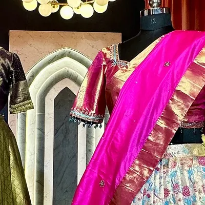 A glimpse of a custom saree lehenga on a mannequin in my studio. This one features a floral brocade skirt paired with a shimmering pink blouse and dupatta.
